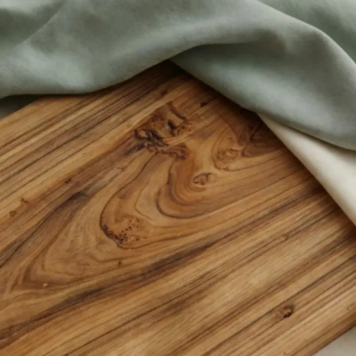 Close-up of natural wood grain and organic fabric textures