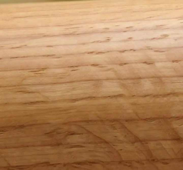 Close-up detail of FSC-certified hardwood grain with organic natural oil finish